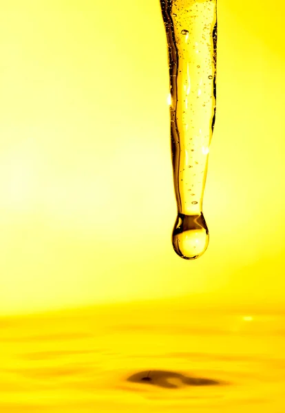 Golden liquid — Stock Photo, Image