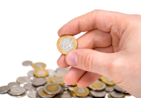 En euro mynt i handen. — Stockfoto