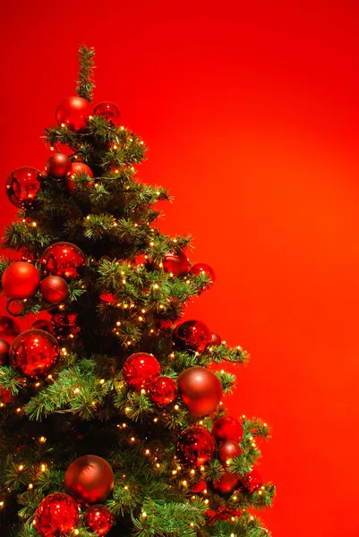 stock image Beautiful Christmas tree on red background.
