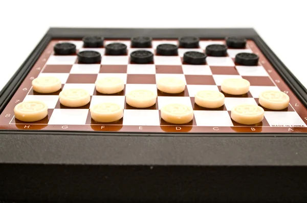 Checkers on a board — Stock Photo, Image