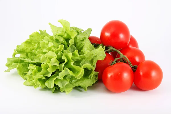 Tomatoes and lettuce on a white background — Stock Photo, Image