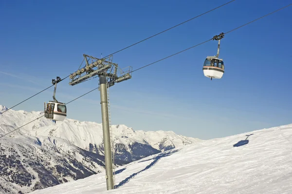 stock image Cabin cars over a ski slope