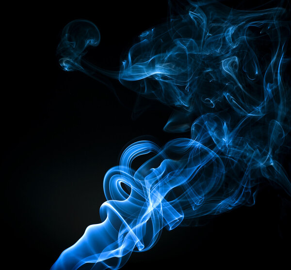 Abstract blue smoke trails on a black background