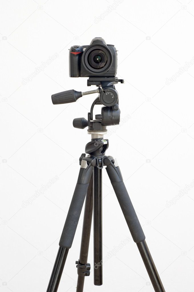 Digital SLR camera on a tripod on white Stock Photo by ©paulvinten 3199109