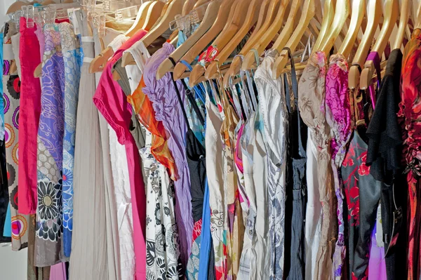 Clothing hanging on a rail — Stock Photo, Image