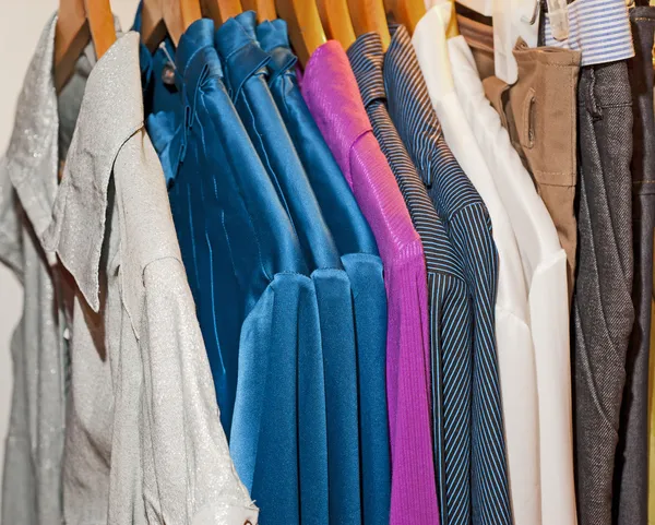 Clothing hanging on a rail — Stock Photo, Image