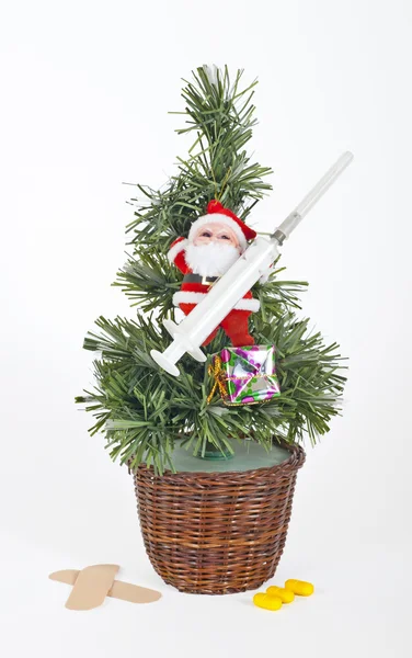 Small xmas tree with santa and medical equipment — Stock Photo, Image
