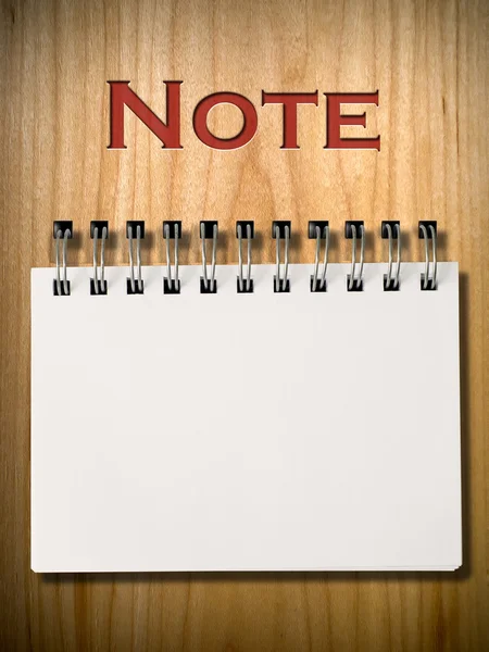 Note Book on wood wall — Stock Photo, Image