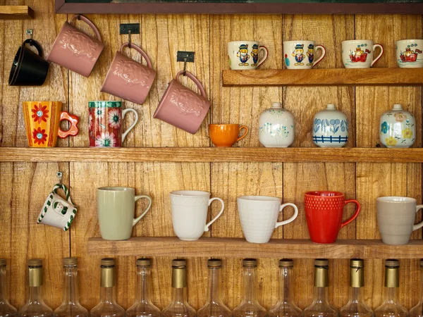 Coffee cup on wood shelf — Stock Photo, Image