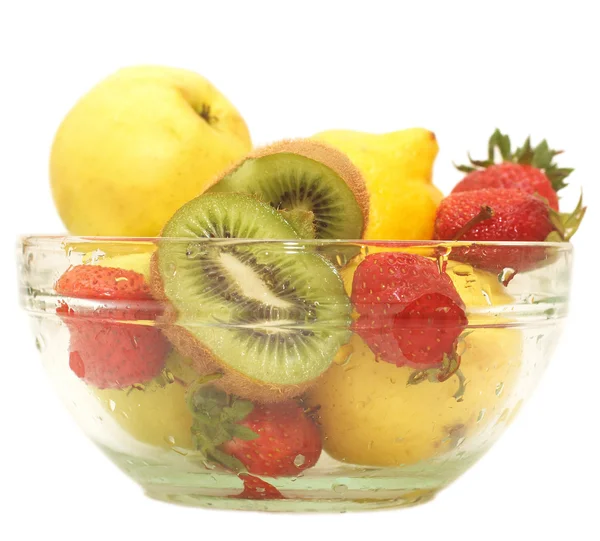 Fresh fruits in glass bowl isolated on white — Stock Photo, Image