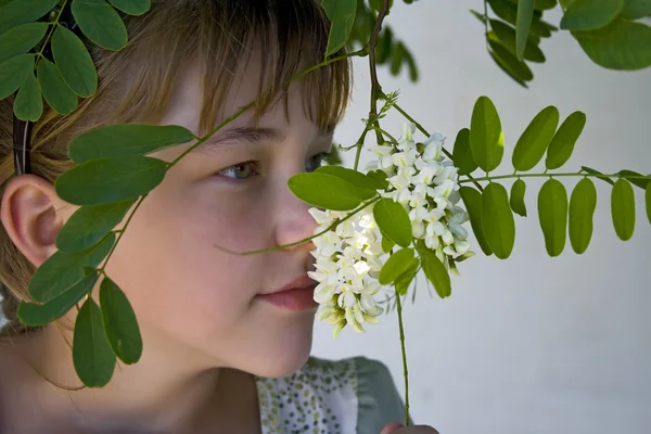 stock image Girl smelling flowers