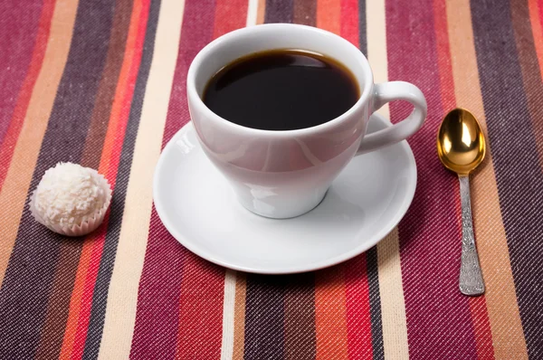 stock image A coffee on a striped tablecloth