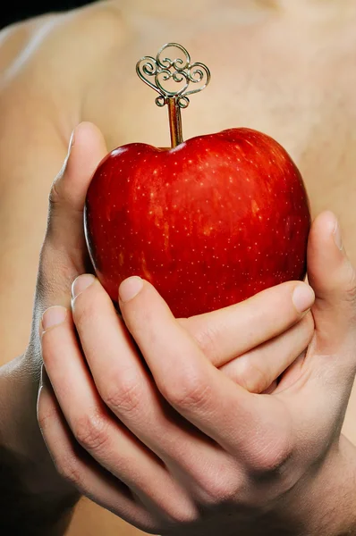 Red apple in man hands — Stock Photo, Image