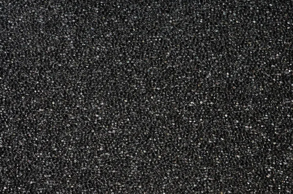 Textur der schwarzen Schwammoberfläche — Stockfoto
