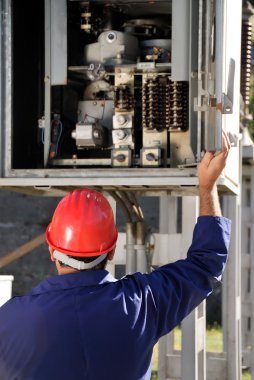 Engineer inspecting wires clipart