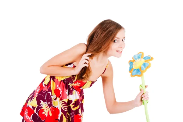 Young sweet cheerful girl with flower — Stock Photo, Image