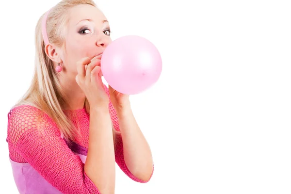 Young alluring girl inflate a balloon — Stock Photo, Image