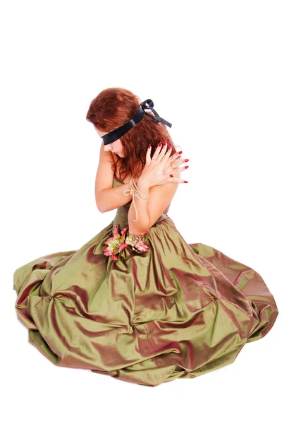 Mooi geblinddoekte meisje in jurk — Stockfoto