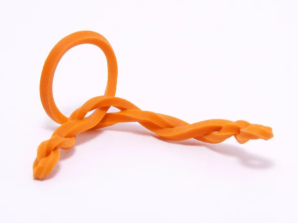 扭曲的橙色橡胶带 — 图库照片