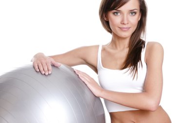 Young woman in doing fitness exercises clipart