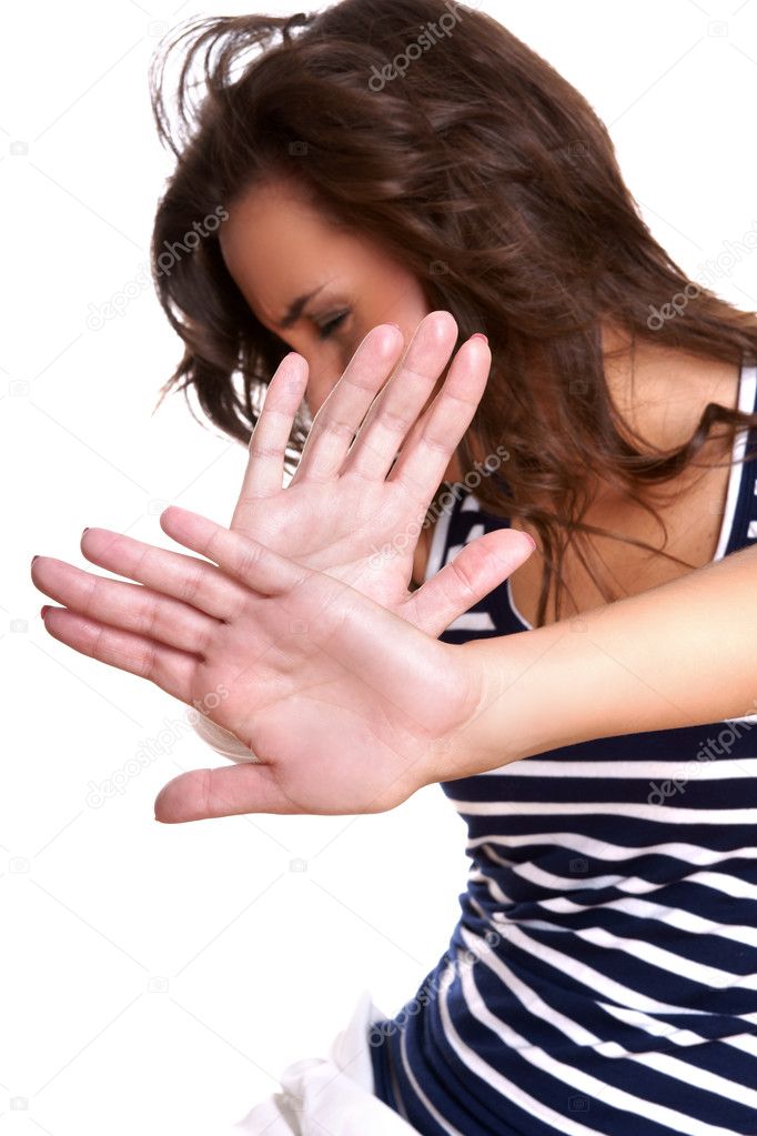 Young woman making stop gesture