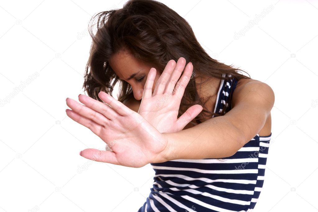 Young woman making stop gesture
