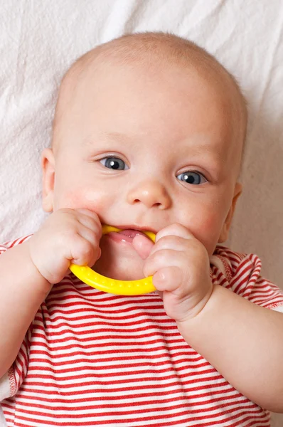 stock image Cute baby with a teething ring