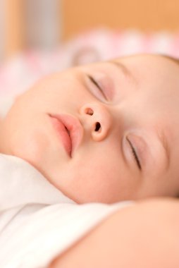 Sweet baby sleeping closeup clipart