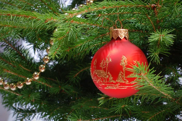 Christmas ball and golden beads — Stock Photo, Image