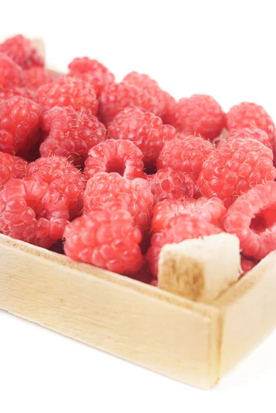 Raspberries in wooden box — Stock Photo, Image