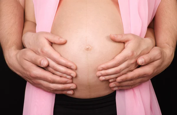 Loving hands on a stomach — Stock Photo, Image