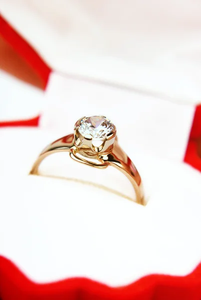 Golden ring with a diamond close-up Royalty Free Stock Photos