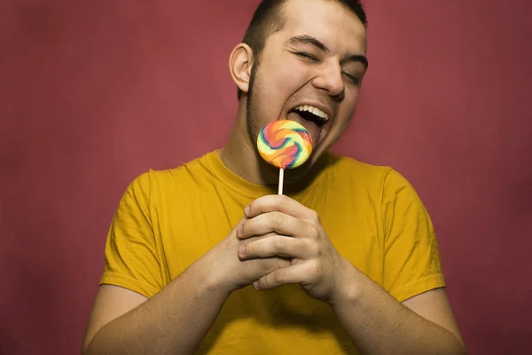 Fiatal macho, lollypop — Stock Fotó