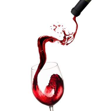 Pouring red wine in glass goblet isolated on white