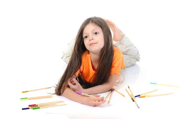 Pequena menina bonita desenha lápis . — Fotografia de Stock