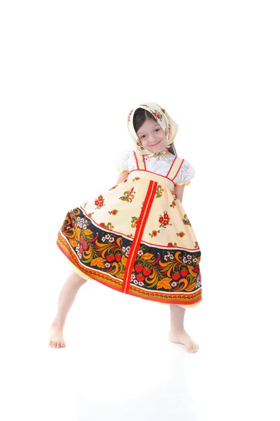 Little girl in a dress dances. — Stock Photo, Image