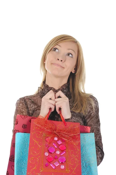 Güzel bir kız ile alışveriş torbaları ararken — Stok fotoğraf