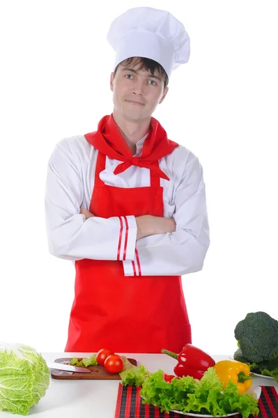 Koch in Uniform steht am Tisch — Stockfoto