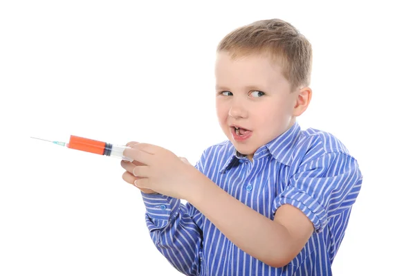 Portrait of a young boy with a syringe — Stock Photo, Image