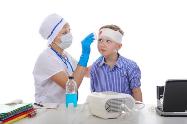 Doctor bandaged the boy's head. clipart