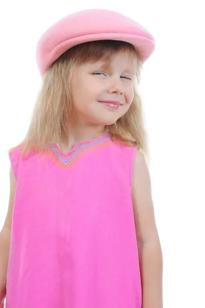 Beautiful little girl in a pink cap. — Stock Photo, Image