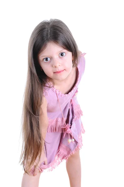 Klein meisje in een roze jurk — Stockfoto
