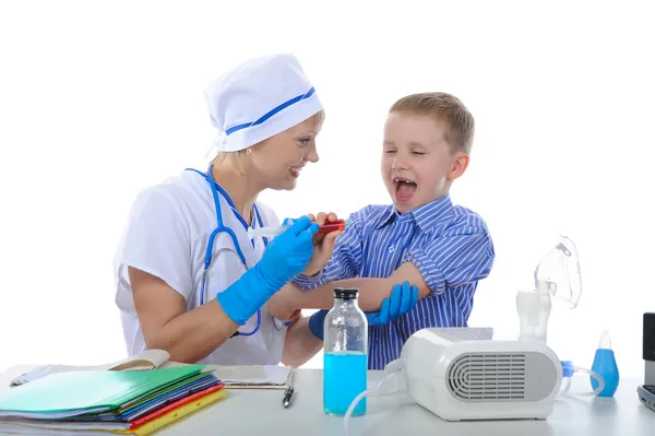 Boy is afraid of injections. Isolated on white background — Stock Photo, Image