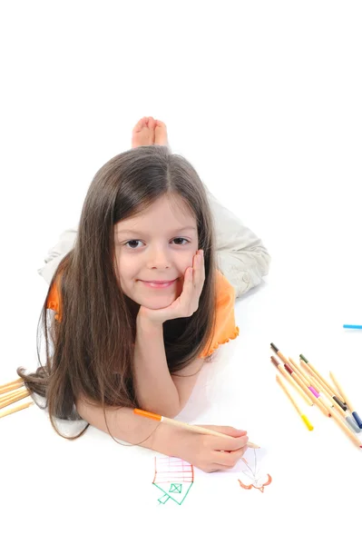 Långhårig liten flicka ritar en prinsessa. — Stockfoto