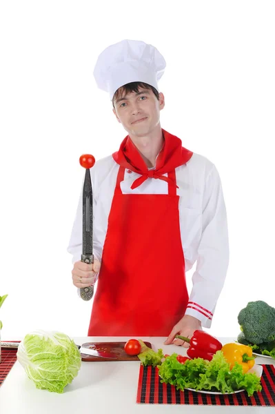 Chef-kok en tomaat op het mes. — Stockfoto