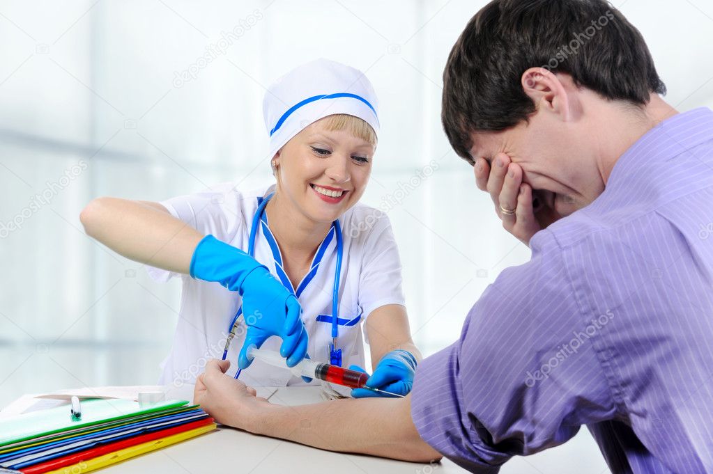 Young doctor makes injection
