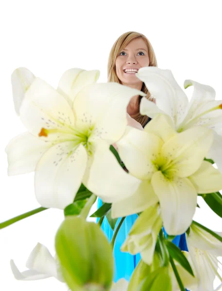 Cheerful young woman with flowers. — Stock Photo, Image