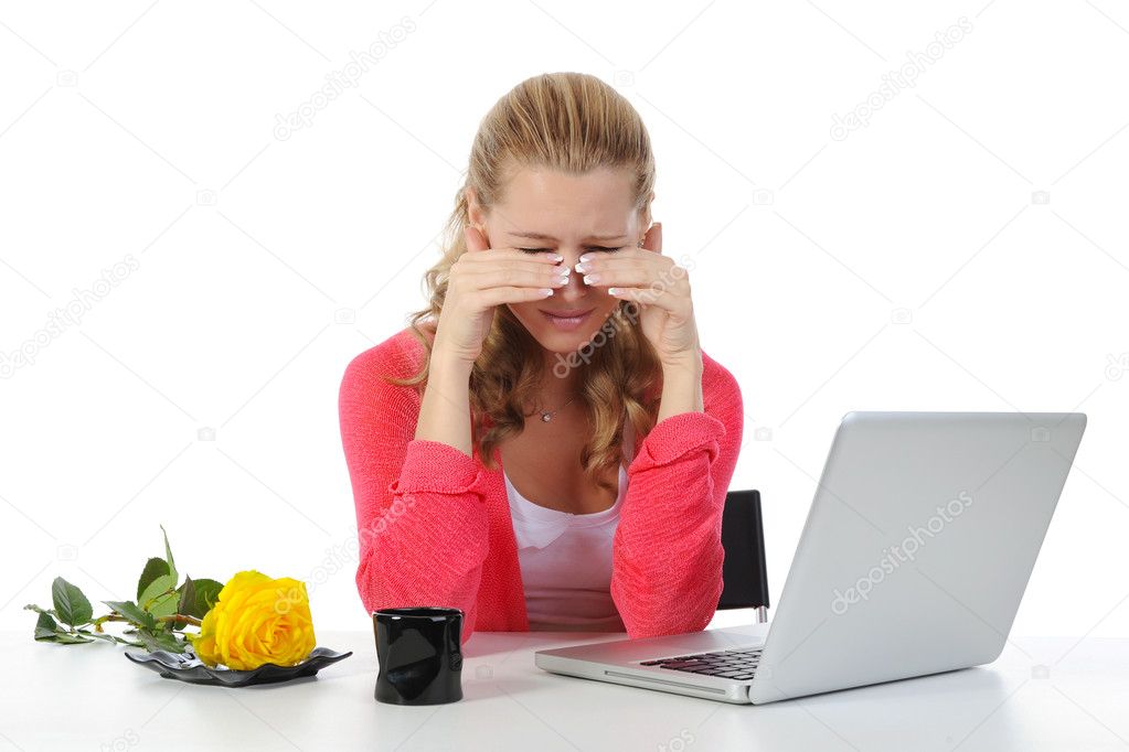 Weeping woman at a computer