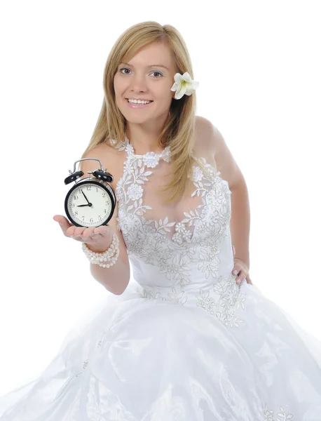 Bride of the alarm clock in his hands. — Stock Photo, Image