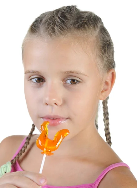 Smiling girl with candy. — Stock Photo, Image